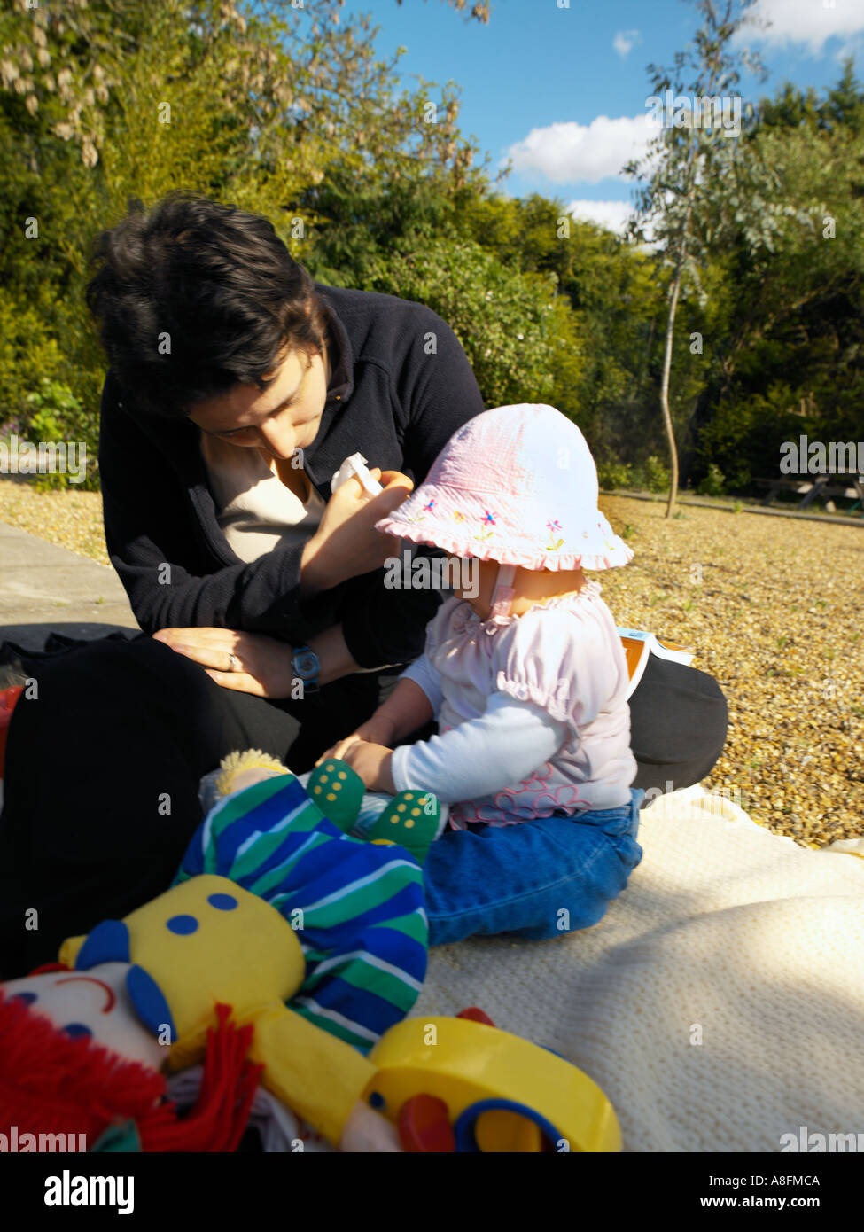 Mother Playing with 8 Month Old Baby Sun Stock Photo Alamy