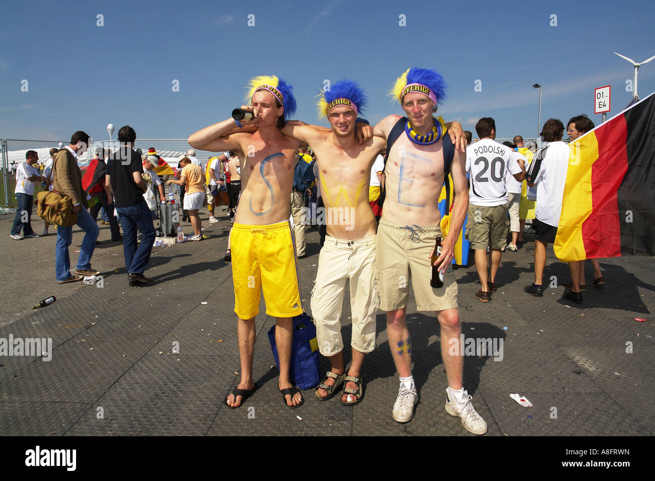 Swedish football fans going to Allianz Arena football stadium in Frottmanning munich Bavaria Germany Stock Photo