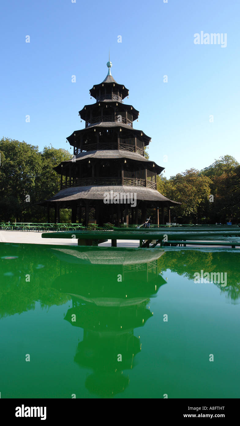 Chinese tower with water reflection at English garden Munich Bavaria Germany Stock Photo