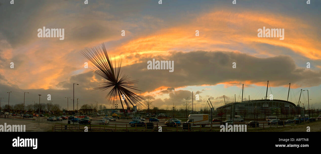 The B of the Bang sculpture and the City of Manchester Stadium at sunset, Manchester, England, UK Stock Photo