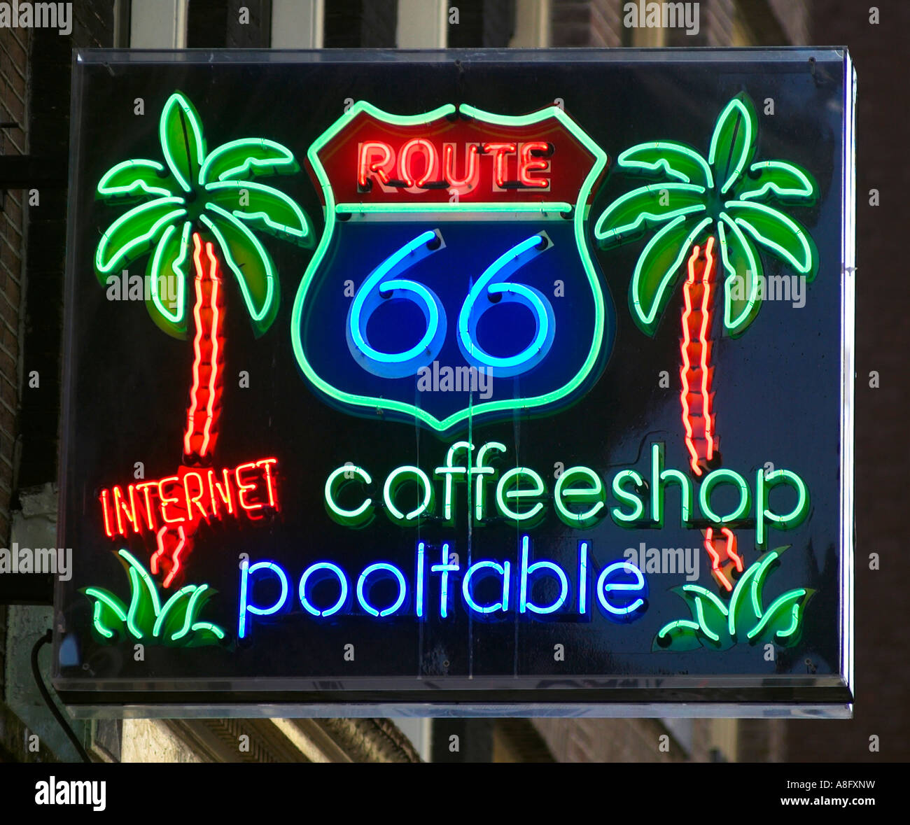 A lit neon sign for the Route 66 coffeeshop in Amsterdam Stock Photo - Alamy