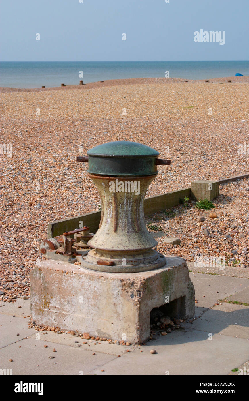 Disused capstan on shingle beach in Sussex, UK Stock Photo