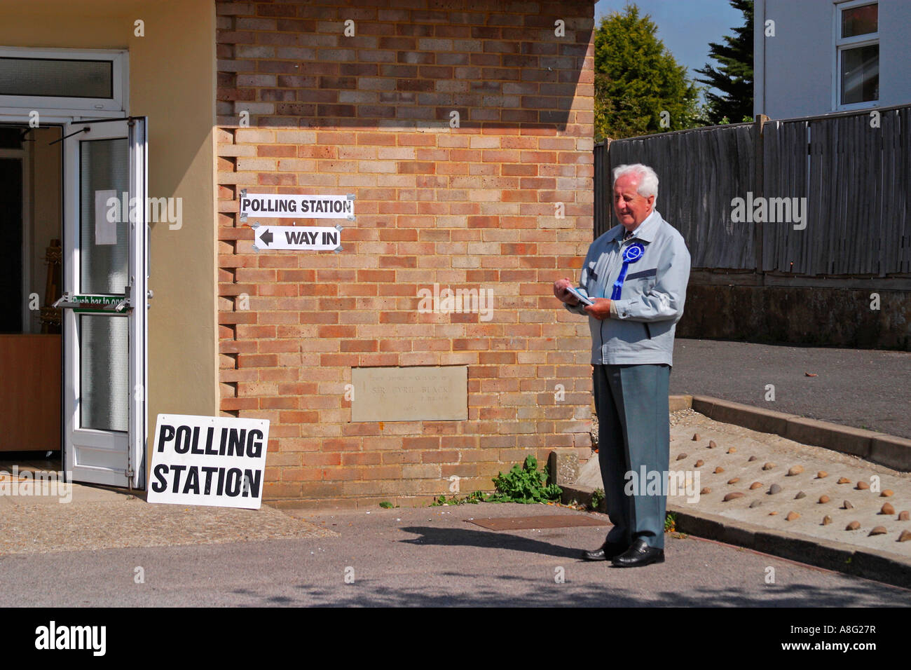Member of Conservative Party conducting an exit poll at a Worthing polling Station for local council elections in Sussex Stock Photo