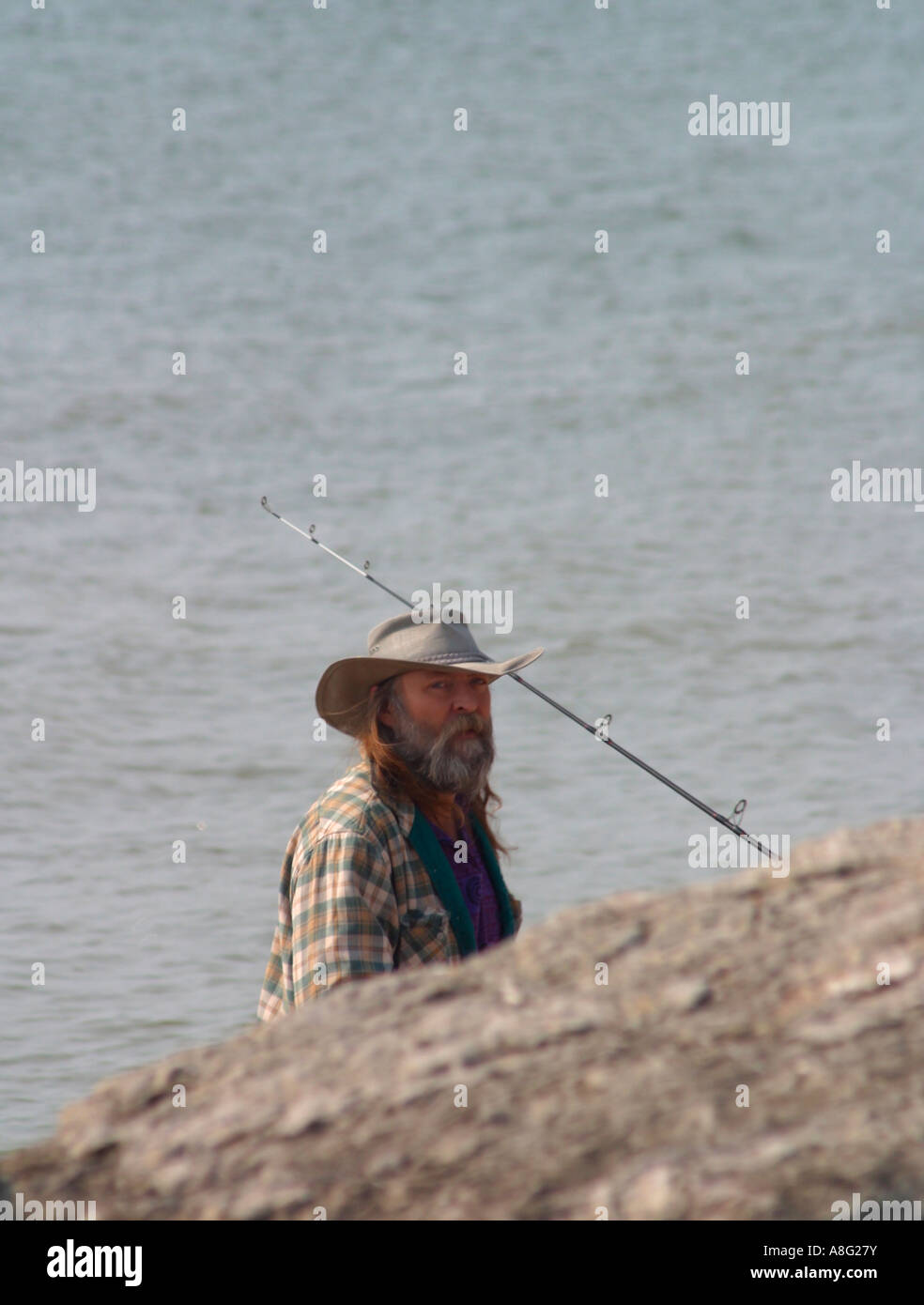 Man wearing a cowboy hat while fly fishing in a river in the afternoon  Stock Photo - Alamy