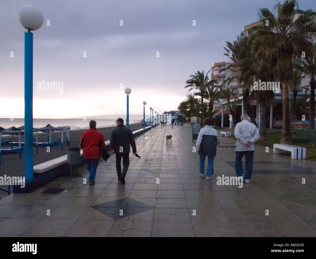 On the promenade at Torrox Costa on a wet winter's day Stock Photo