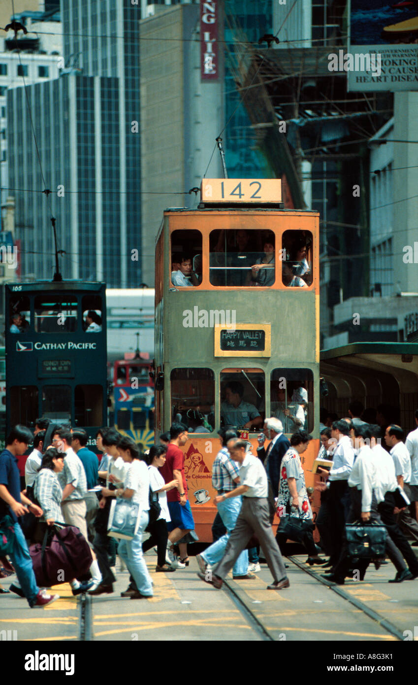tram at congested pedestrian crossing, Hong Kong, China Stock Photo