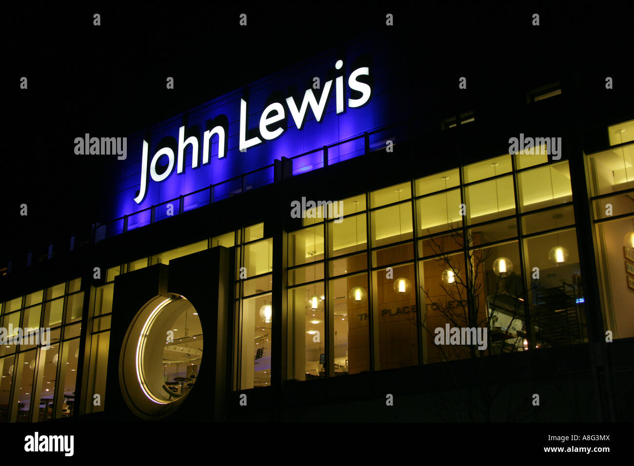 Illuminated John Lewis department store logo and "The Place to Eat