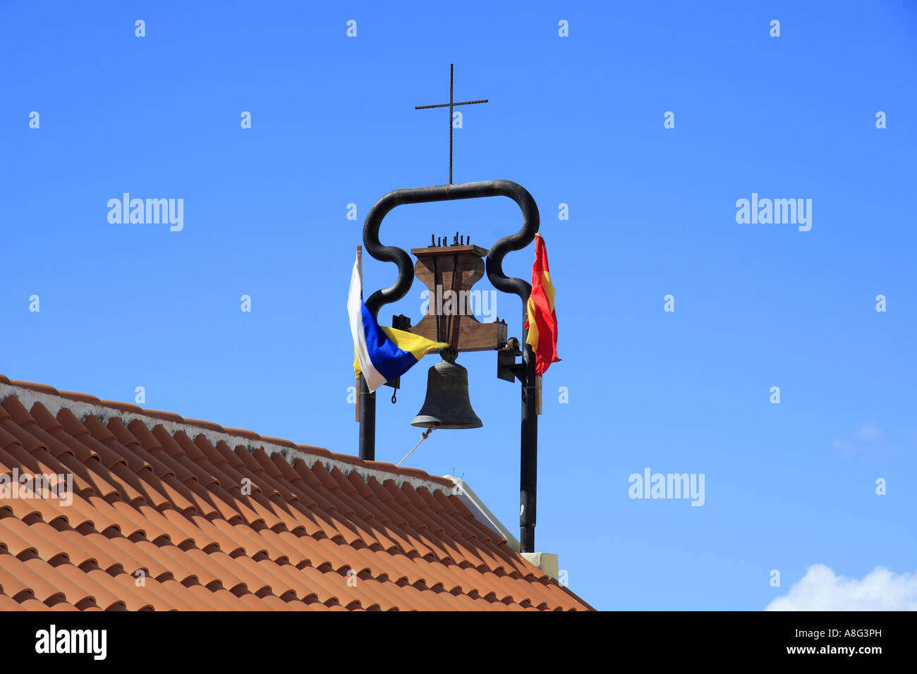 Church bell & flags at Aguadulce Tenerife Canary Islands Spain Stock Photo