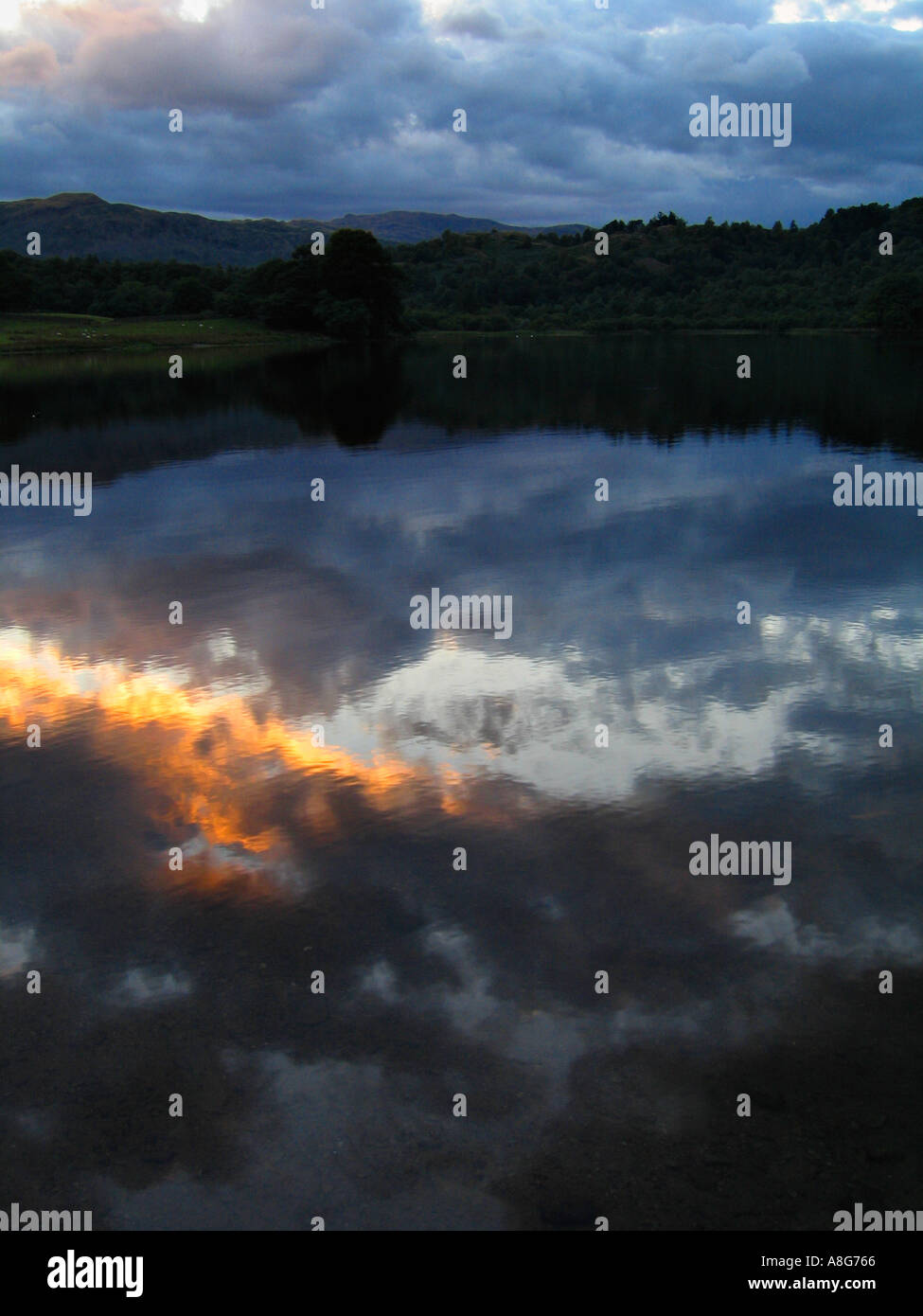 Sunset reflection in Rydal Water in the Lake District National Park, near Ambleside and Grasmere. Stock Photo