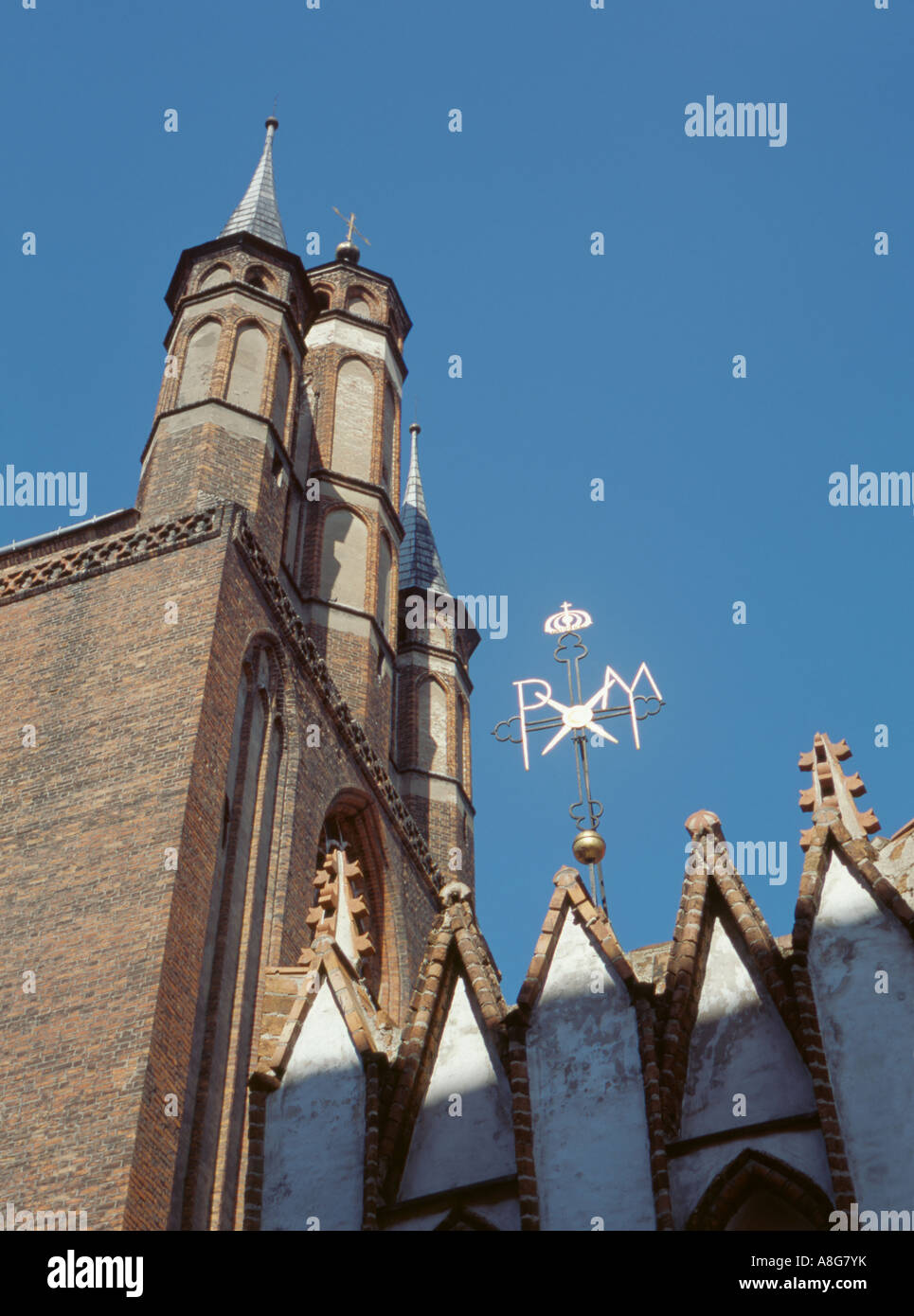 Pax sign and spires of the Church of the Assumption of Our Lady, or St Mary's Church, Torun, Pomerania, Poland. Stock Photo