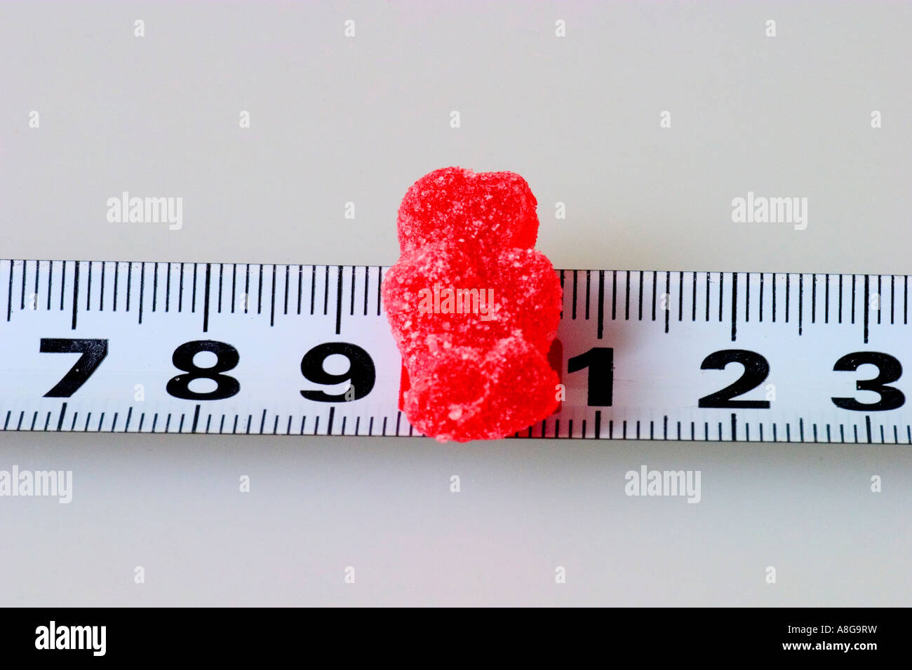 Gummy bear on a tape measure Stock Photo Alamy