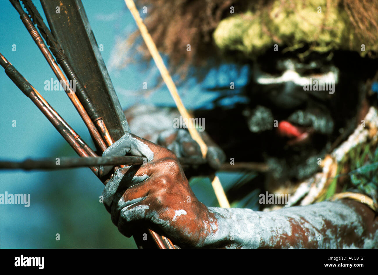 decorated aboriginal with bow and arrow, Mt. Hagen, Papua New Guinea Stock Photo