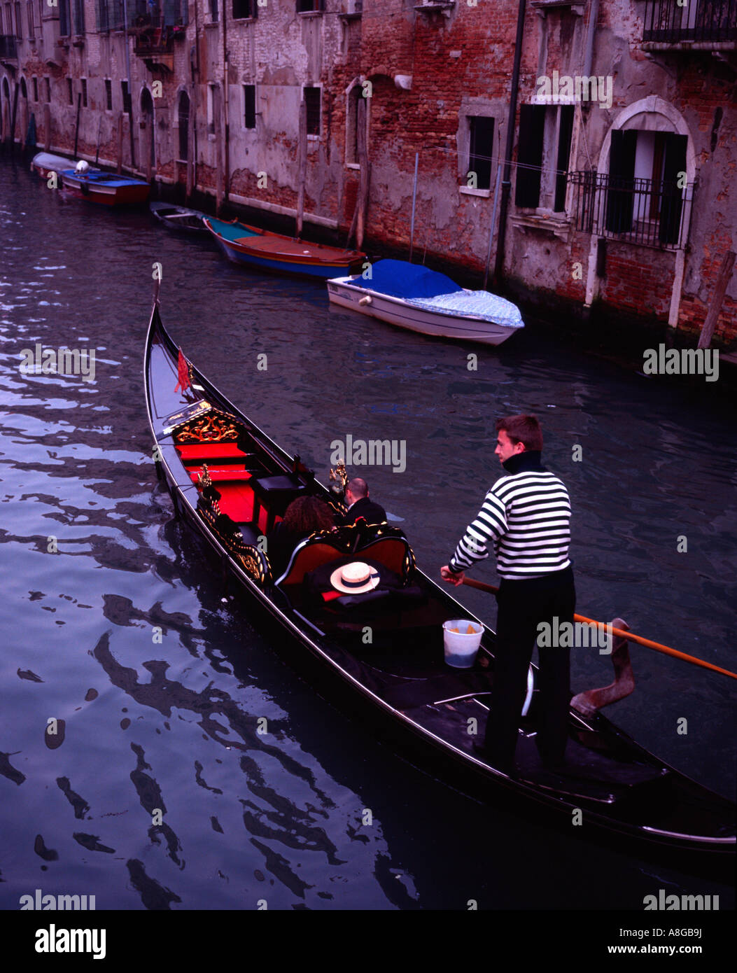 Traditional gondola on narrow hi-res stock photography and images - Alamy