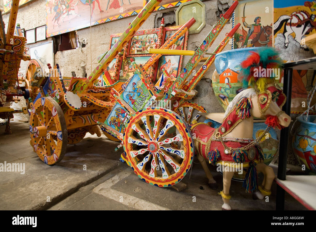 Traditional hand painted Sicilian carts in the workshop and studio of artist Franco Bertolino Palermo Sicily Italy Stock Photo