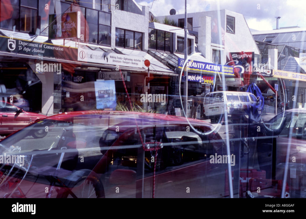 Reflections in a main street window depicting Queenstown s wealth of ...