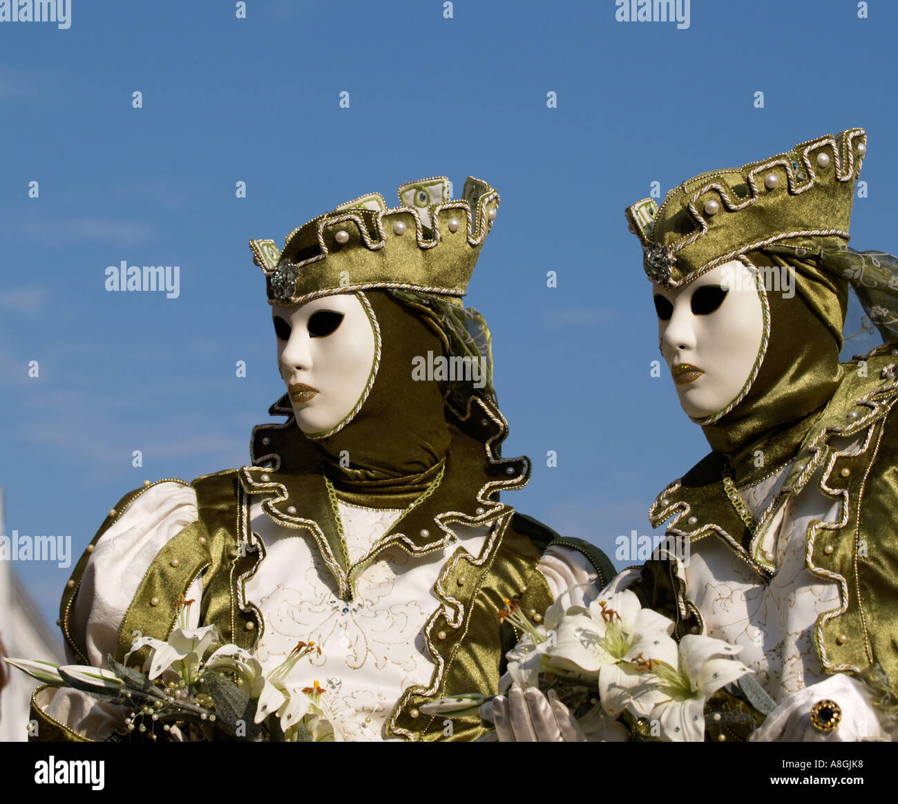 two women wearing green costumes Venice carnival Stock Photo - Alamy