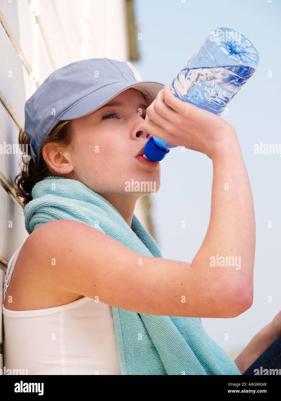 Portrait of young sportive teen girl with a bottle of drinking water Stock  Photo by ©Cherry-Merry 113908888