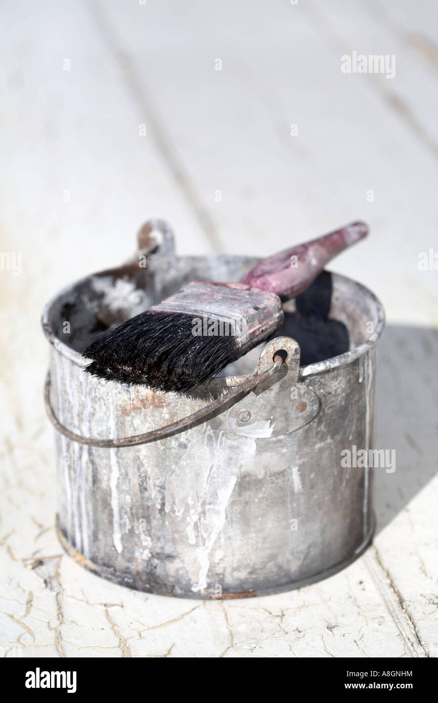 cleaned used paint brush resting on paint kettle Stock Photo Alamy