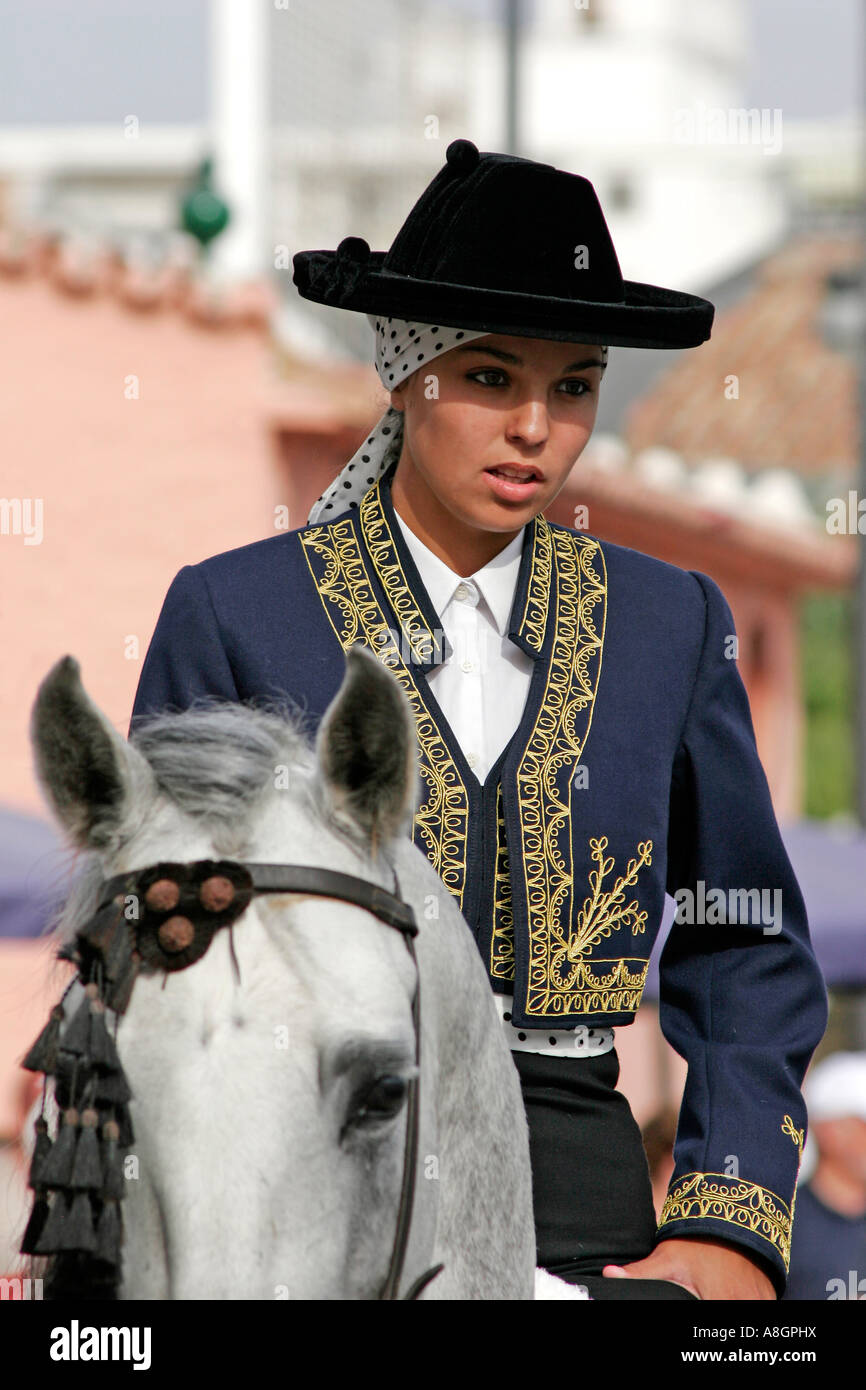 girl to horse in the fair of fuengirola Malaga coast of the sun Andalusia Spain Stock Photo