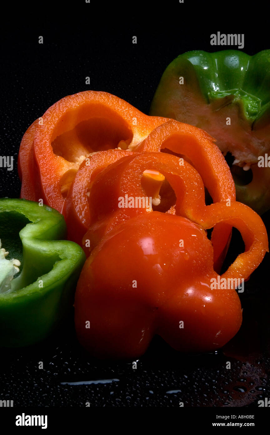 Sliced orange and green peppers studio still life Stock Photo