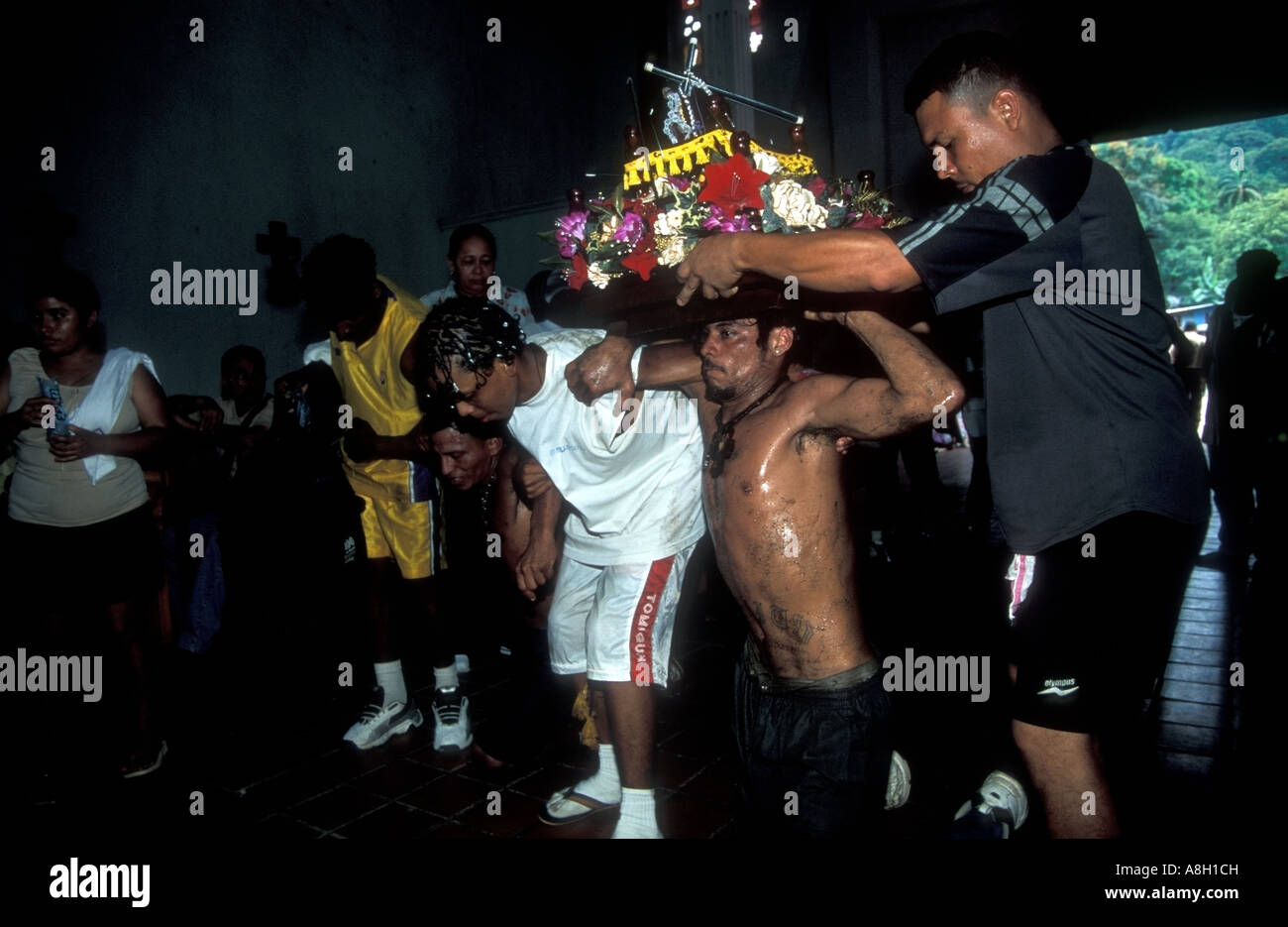 A pilgrim entering to the Catholic Church during the black Christ festival Panama Stock Photo