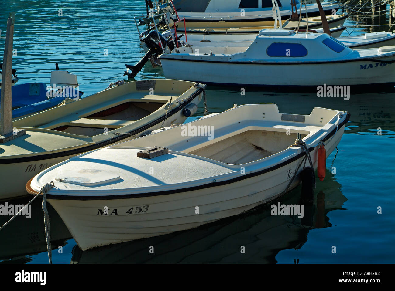 Small boats people moored hi-res stock photography and images - Alamy