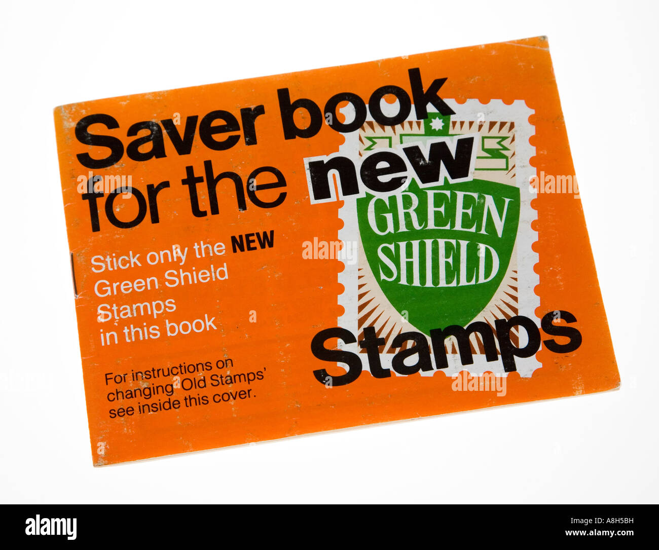Green Shield stamps in book from 1970s used to collect points from purchases in petrol stations and shops UK Stock Photo
