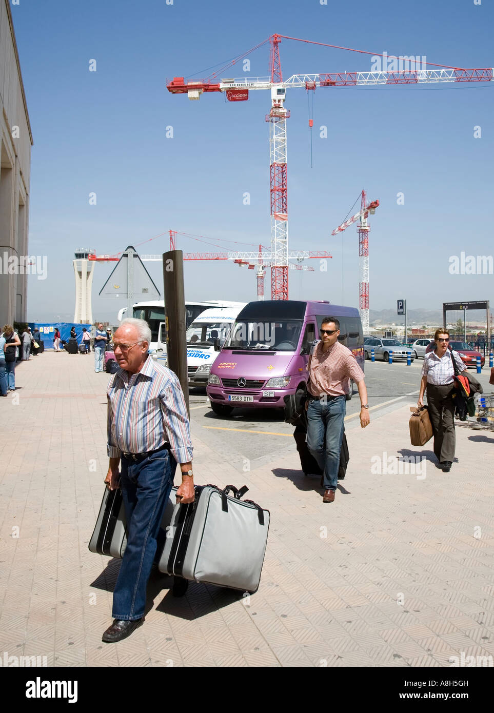 Passengers arriving at airport with shuttle buses Malaga Andalucia Spain Stock Photo