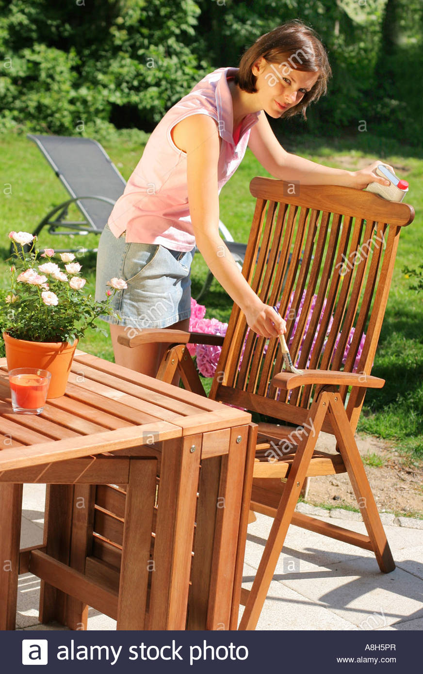 Woman Oiling Garden Furniture Stock Photo 12103774 Alamy