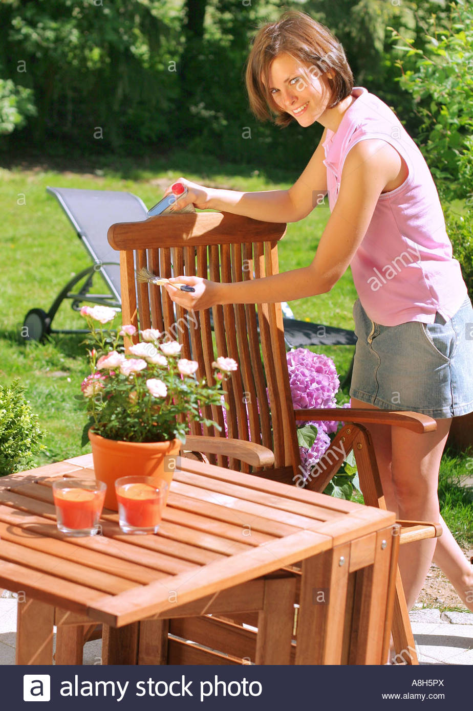 Woman Oiling Garden Furniture Stock Photo 12103777 Alamy