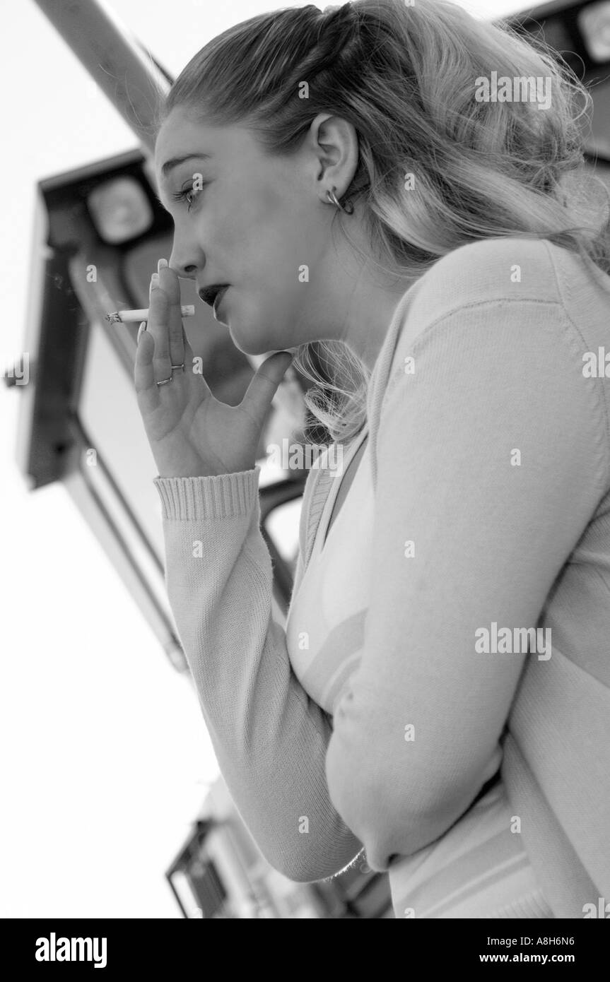 Black and White Closeup of Caucasian Teen Girl (17-20) Smoking Cigarette USA Stock Photo