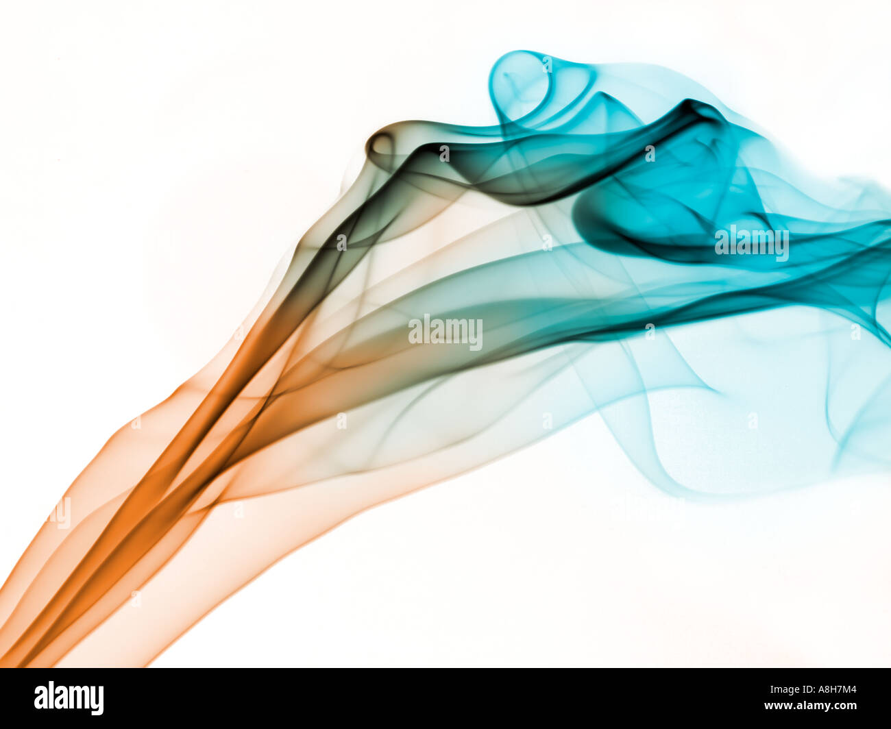 Colorized incense smoke trails on a white background Stock Photo