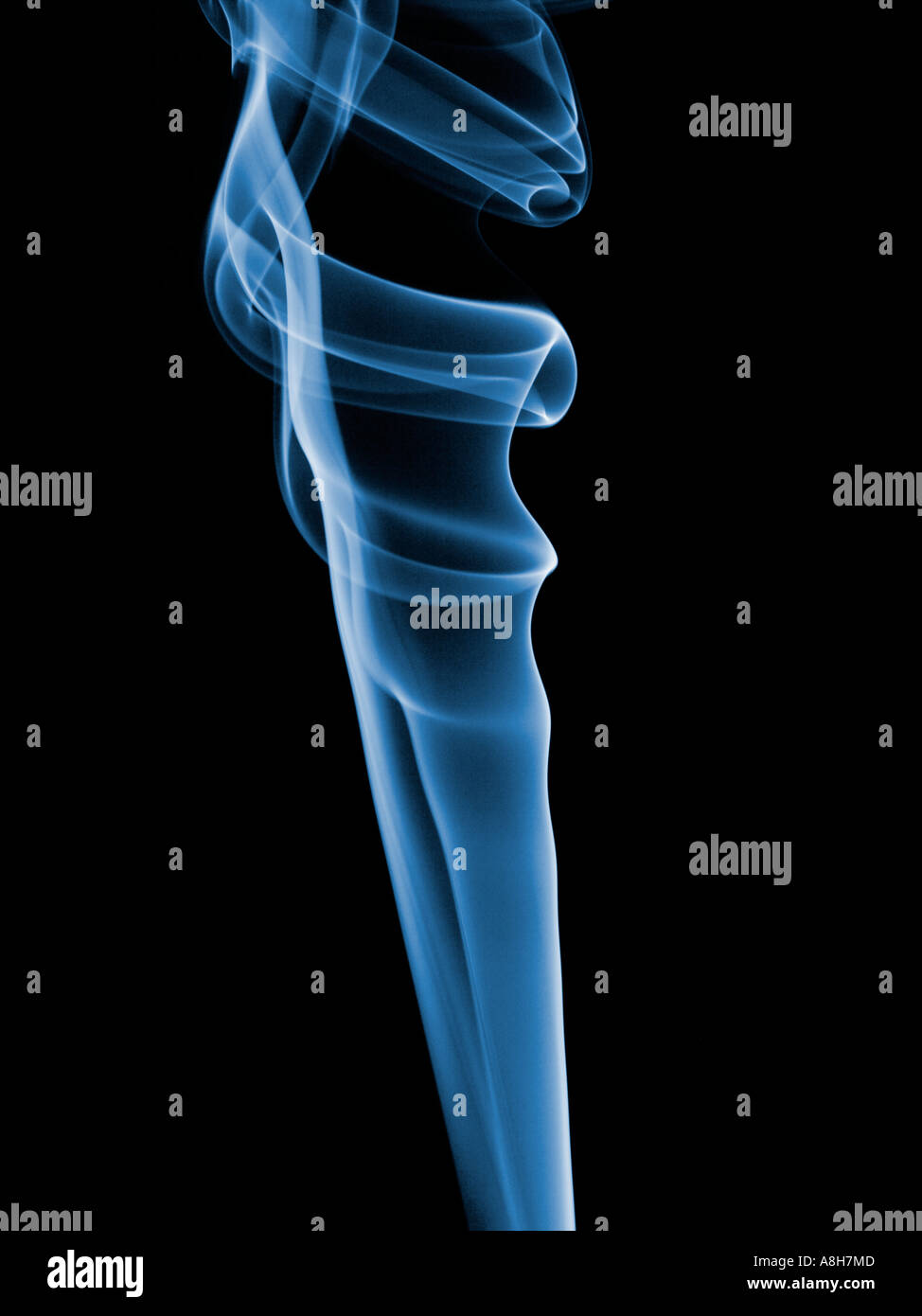 Colorized incense smoke trails on a black background Stock Photo