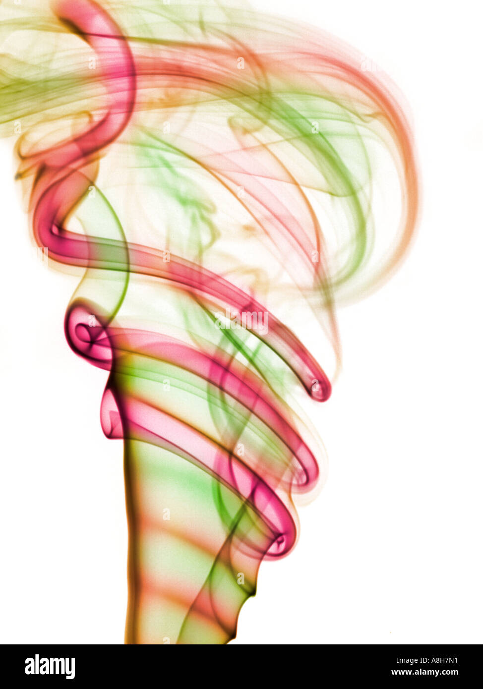 Colorized incense smoke trails on a white background Stock Photo