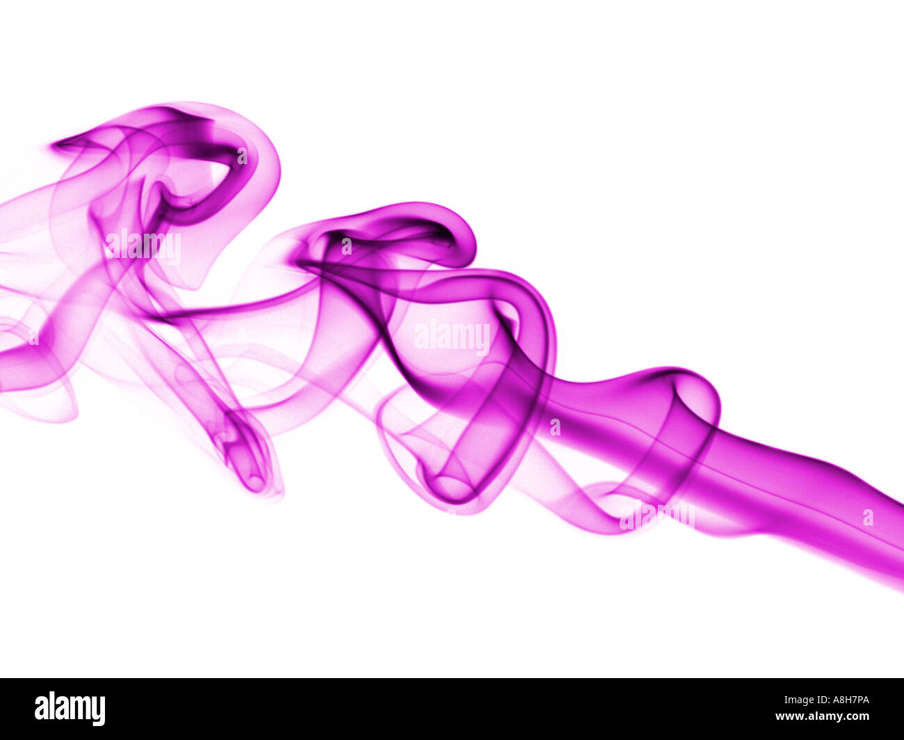 Colorized incense smoke trails on a white background Stock Photo