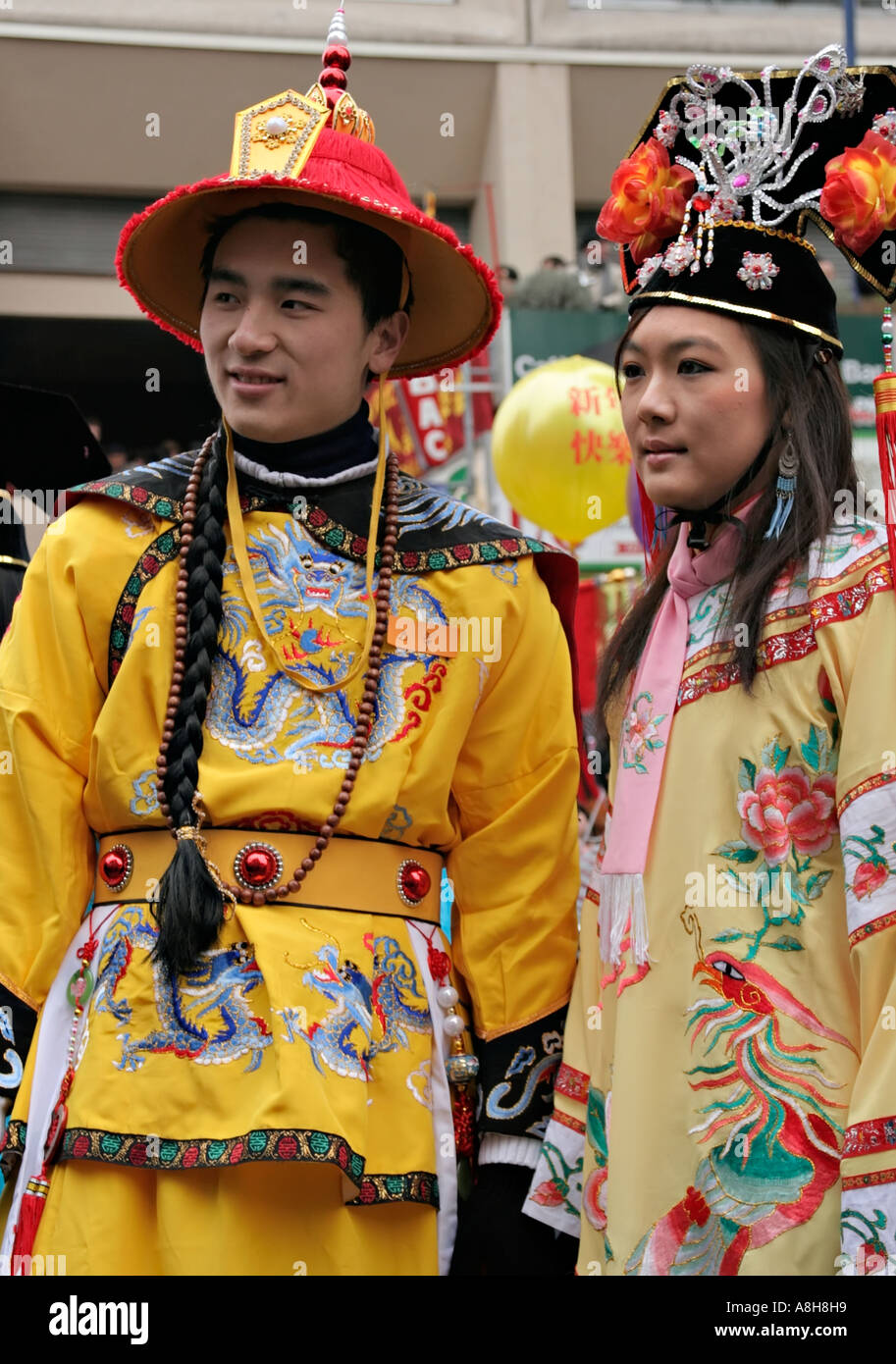 A man and a woman wearing traditional costumes at the Chinese New Year