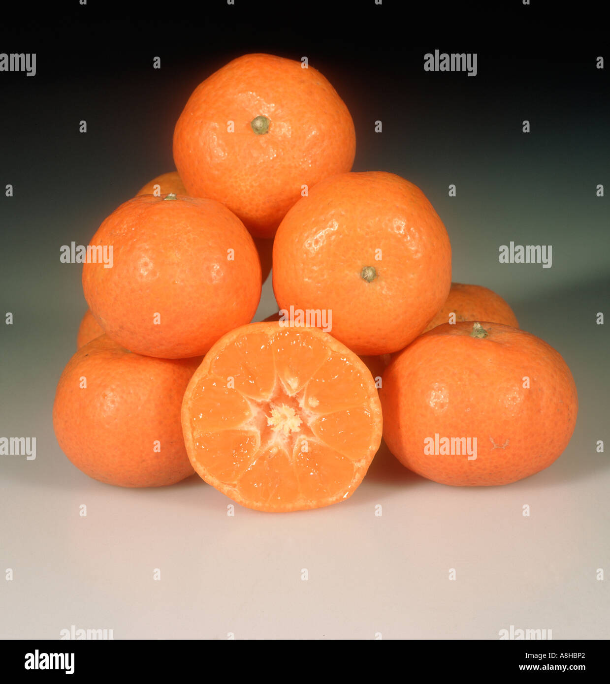 Group of mandarin fruit whole sectioned variety Sunk Mandarin Stock Photo