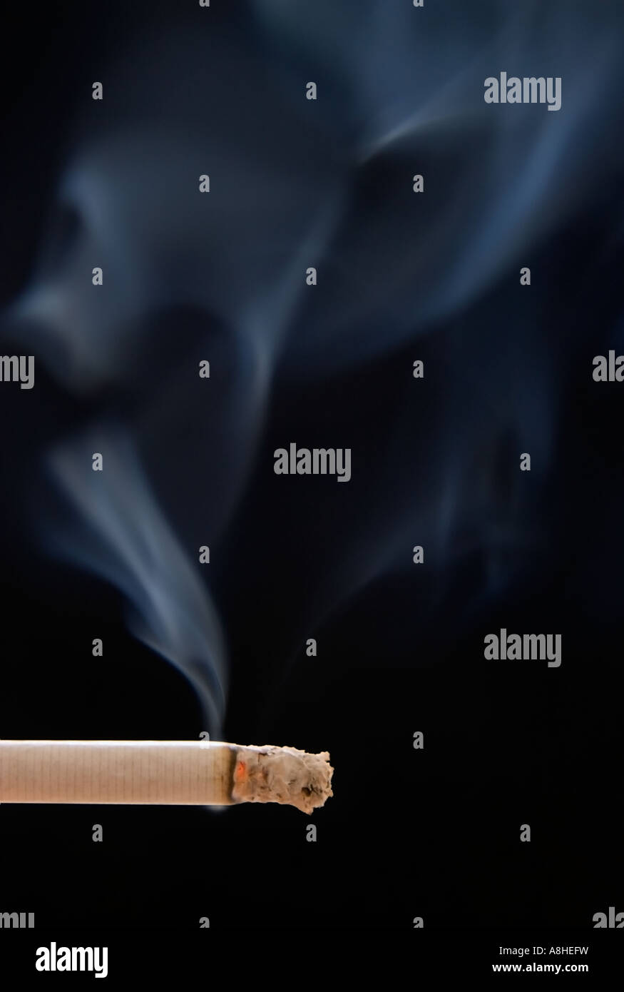 smoke coming out of cigarette making ghosts figures Stock Photo - Alamy