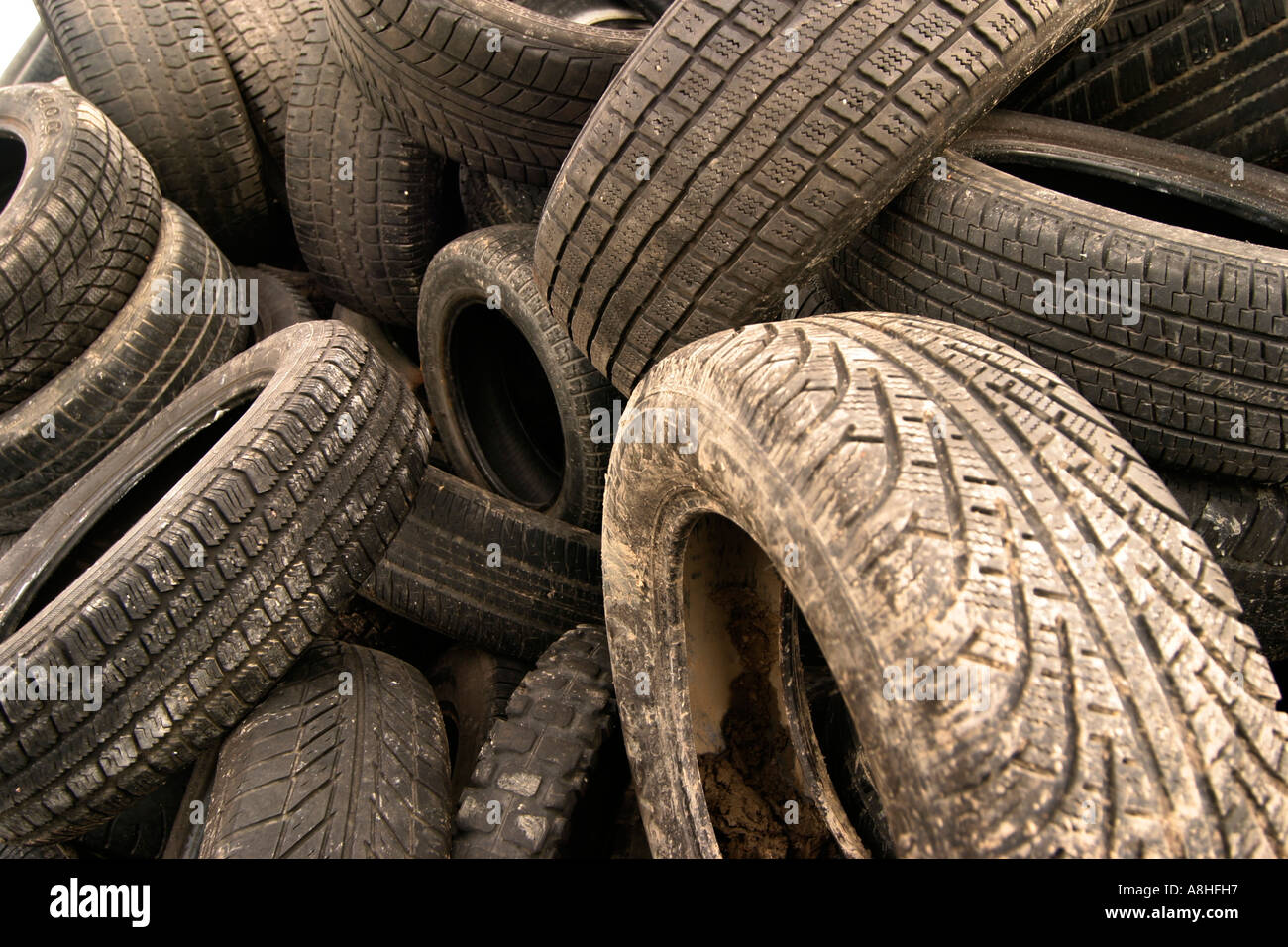 Old motor-car tires on a garbage depot Stock Photo