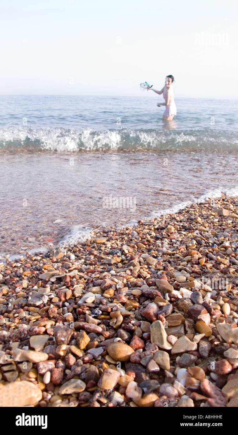 Close up of the shingle and water at the shoreline Nuweiba on the Red Sea Coast Sinai Egypt Stock Photo