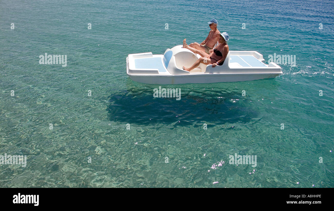 A mature couple on a pedalo Holidaying at Nuweiba on the Red Sea Coast Crystal clear waters Sinai Egypt Stock Photo