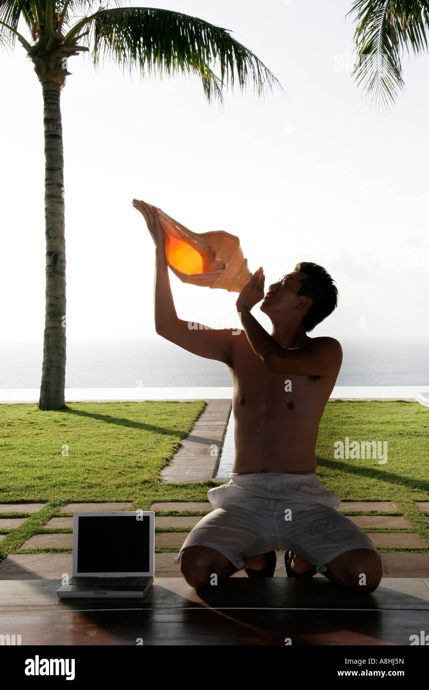 Man with a conch Stock Photo - Alamy