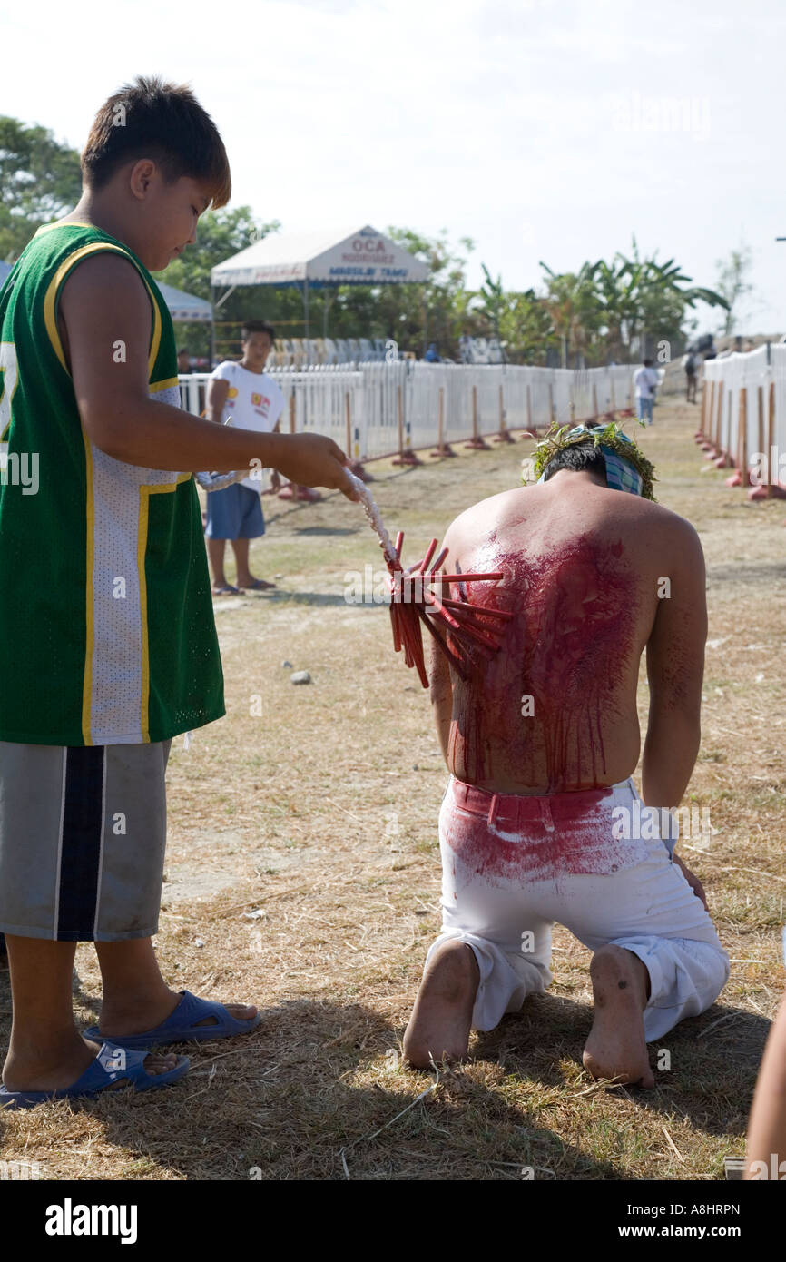 Penitents Flagellate, Crucifixion of flagellants, Good Friday Lenten Rites, San Pedro Cutud, San Fernando, Philippines Stock Photo