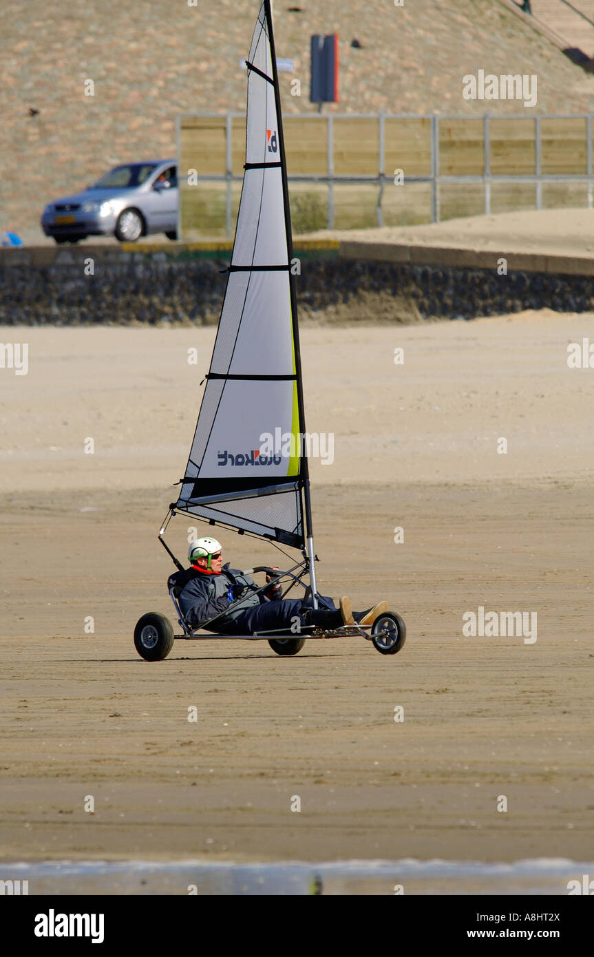 Blow car on the beach from city place Scheveningen Zuid Holland with mid age men Stock Photo