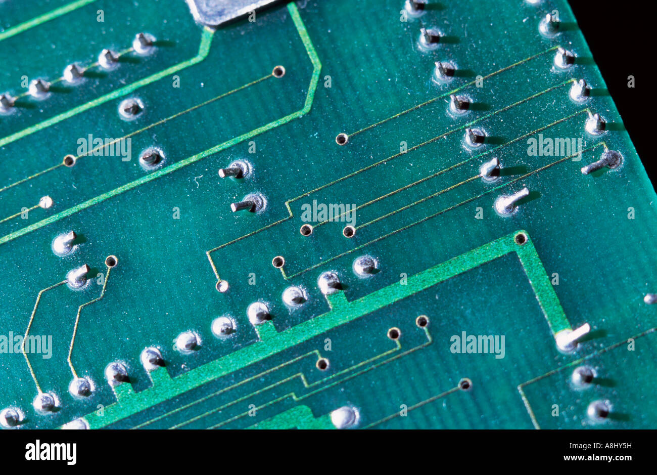 Eectronics printed circuit board showing conductive traces and through