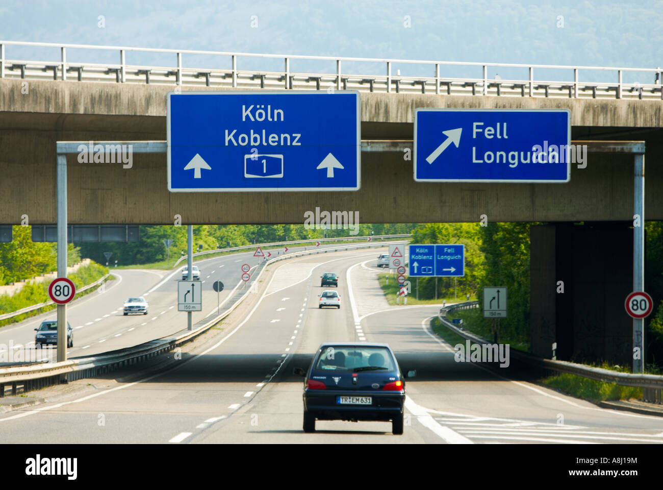 Cars driving on a German autobahn motorway road in Germany, Europe near Cologne Stock Photo