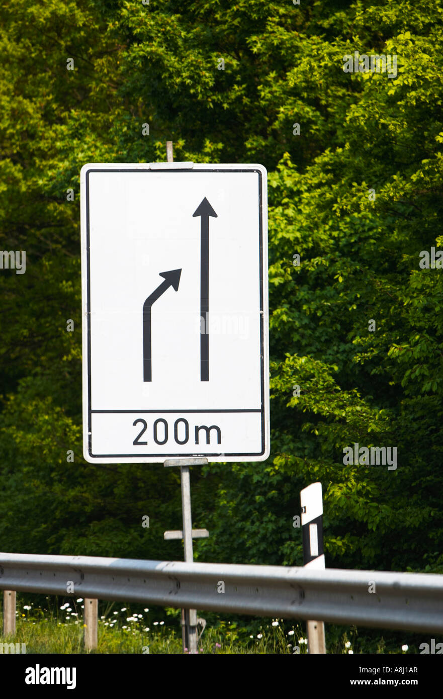 German autobahn road sign warning of merging traffic lanes ahead Germany Europe Stock Photo