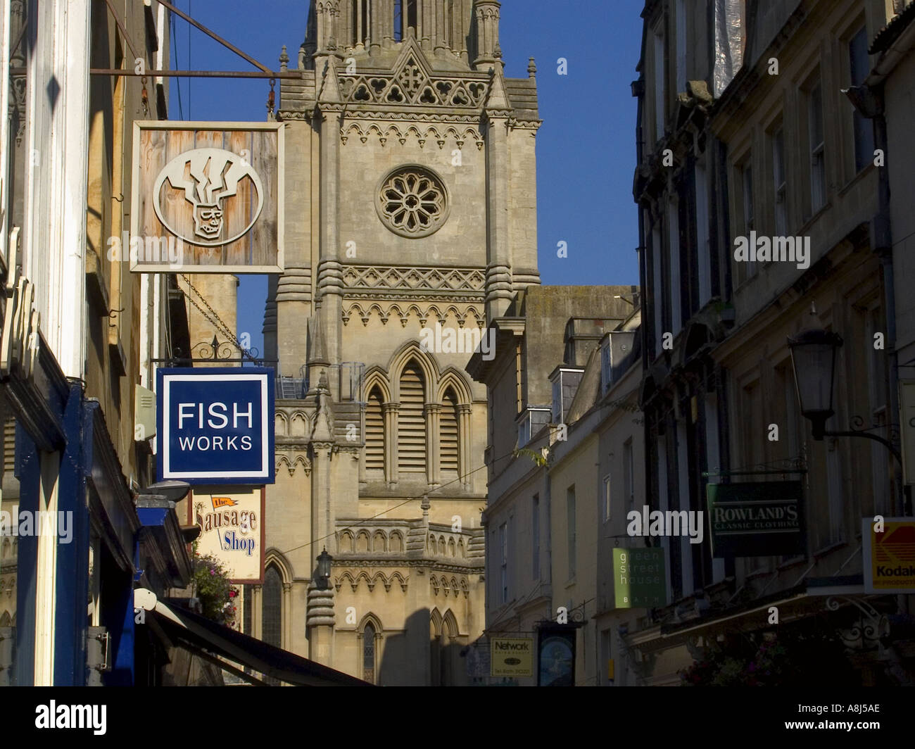 Green Street, Bath, signage at fascia level, St Michaels Without church in rear, Bath, Avon, England Stock Photo