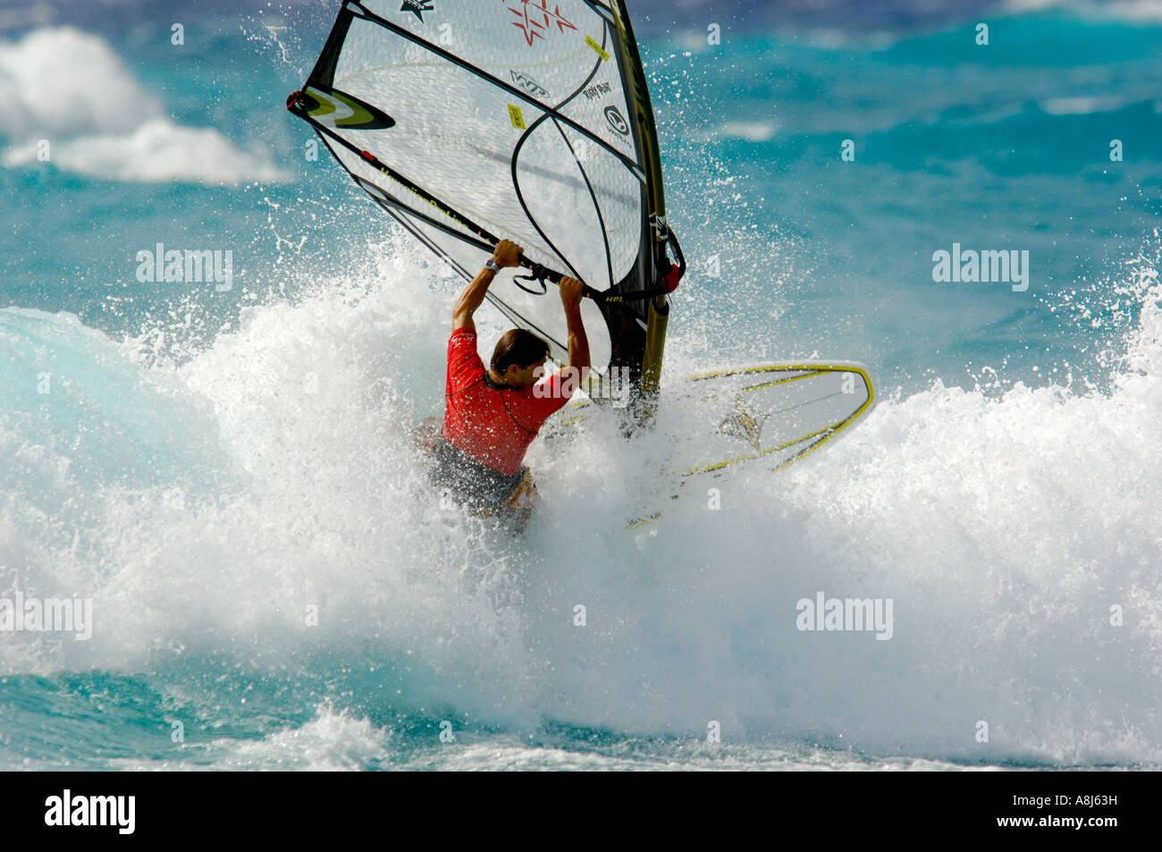Windsurfing on Barbados men on the bleu wave s in the middle of the