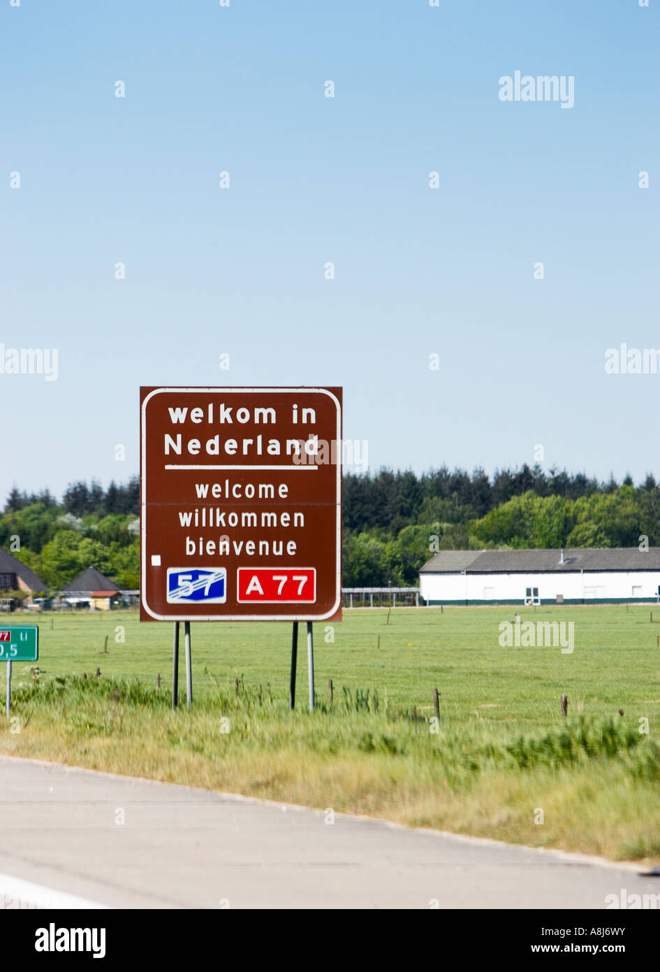 European country border - Welcome to Netherlands sign at the border driving from Germany, Europe Stock Photo